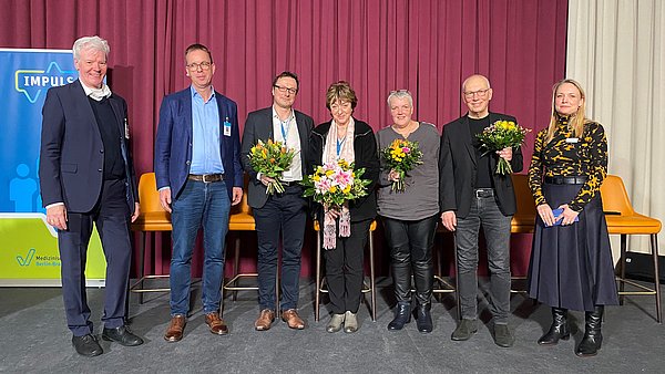 Gruppenfoto von Rednerinnen und Rednern auf dem Impulstag.